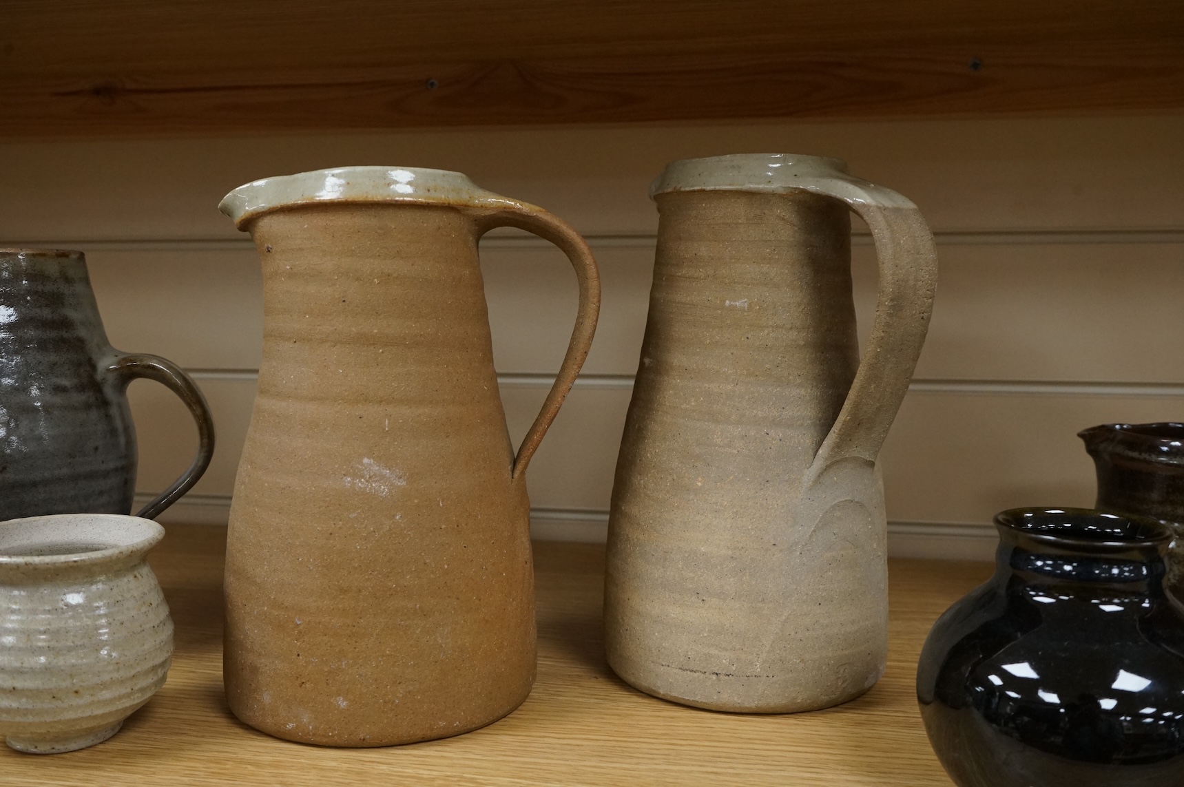 A group of Leach St. Ives pottery jugs and a pot and three other studio items of studio ceramics, some with impressed marks, largest 25cm high